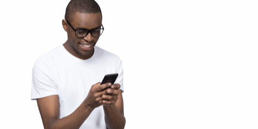 <strong>Don’t just read as a reader</strong>. Read as a writer. <a href="https://www.shutterstock.com/image-photo/smiling-black-young-man-glasses-holding-1296335626" rel="noopener" target="_blank"><em>Image by fizkes</em></a>