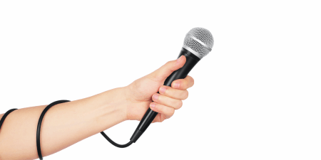 <strong>Research project</strong> Conduct three types of research before you write. <a href="https://www.shutterstock.com/image-photo/female-hand-microphone-on-white-background-411111055" rel="noopener" target="_blank"><em>Image by vipman</em></a>